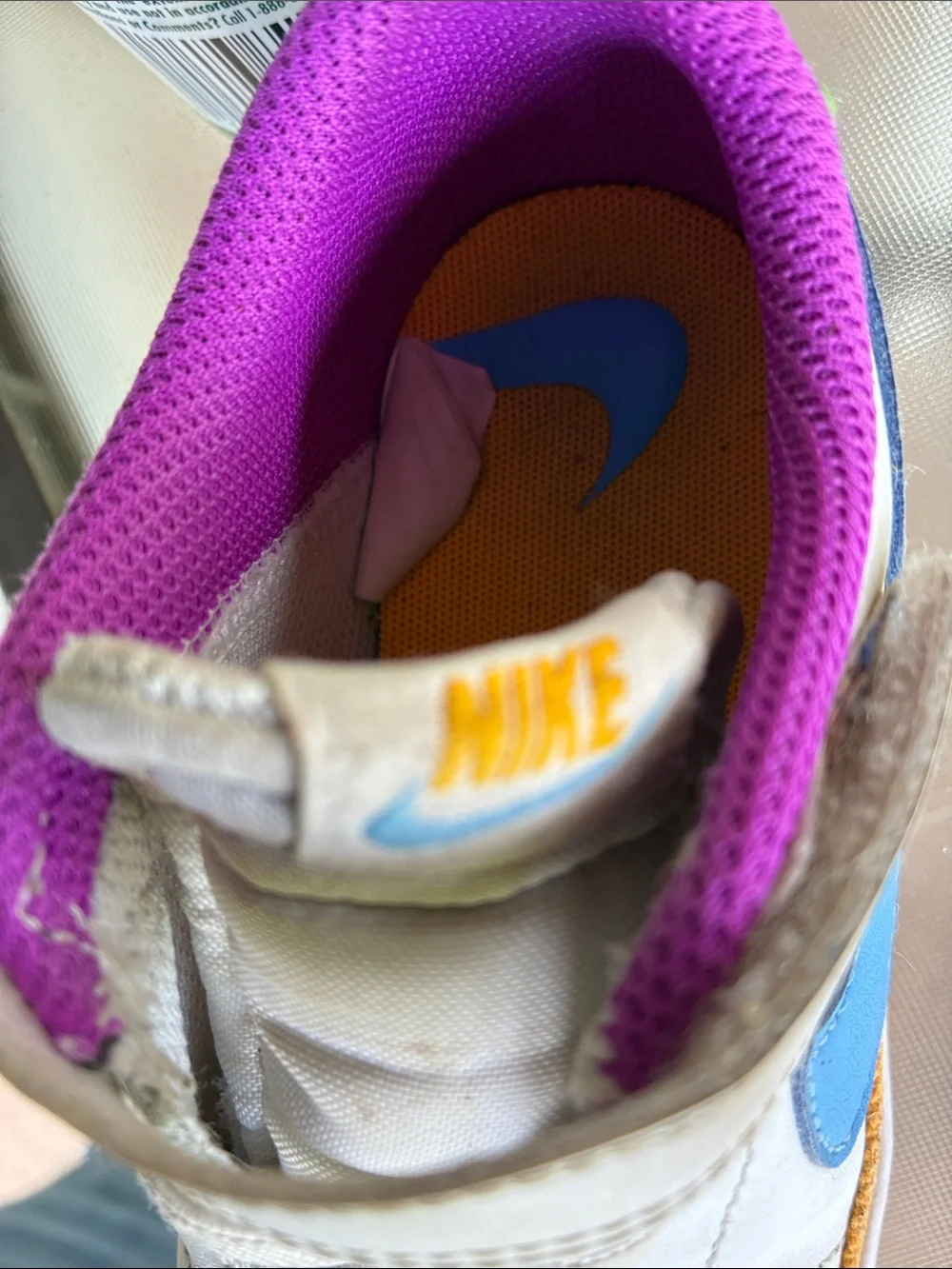 Nike Kids White Sneakers with Purple Lining and Blue Accent
